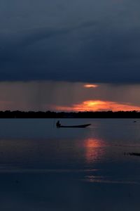 Scenic view of sea against sky at sunset