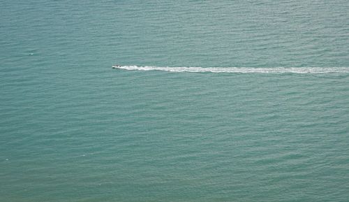 High angle view of boat sailing in sea