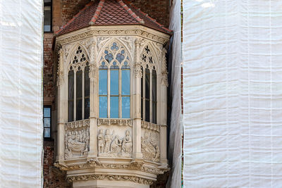 Low angle view of ornate window on building