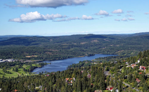 Scenic view of lake and mountains against sky