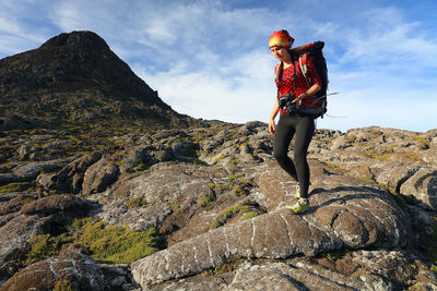 Full length of person standing on rock