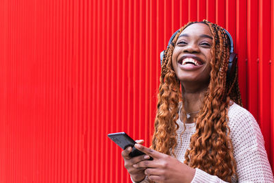 Mid adult woman using mobile phone