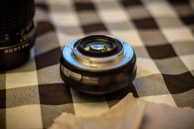 High angle view of lens on textile