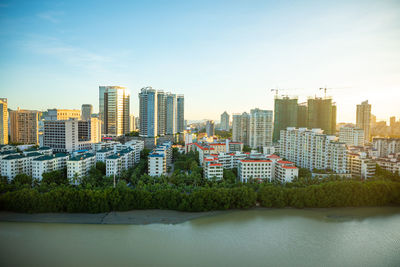 Buildings in city against sky