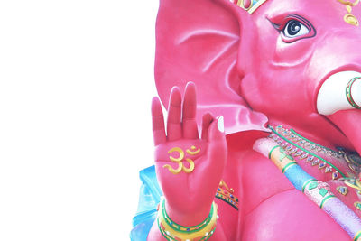 Close-up of statue against pink background