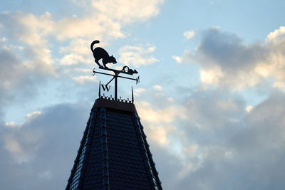 Low angle view of weather vane