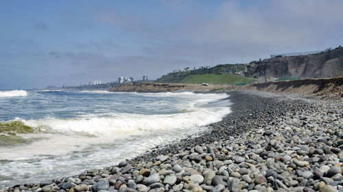 Scenic view of beach against sky