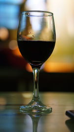 Close-up of wineglass on table