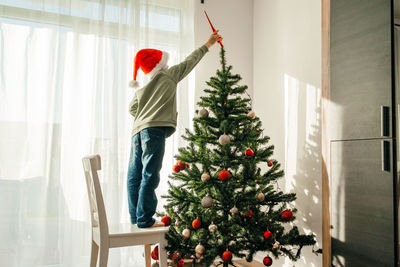 New year's and christmas. children are waiting for the holiday. child boy in a santa claus hat