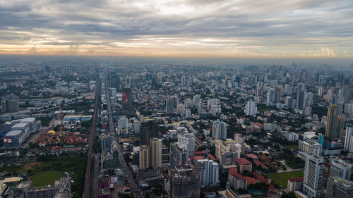 High angle view of city against sky during sunset