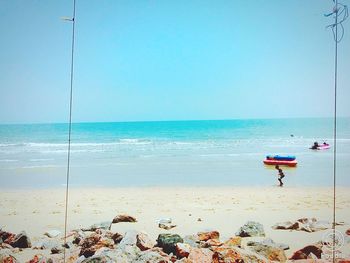 Scenic view of beach against clear sky