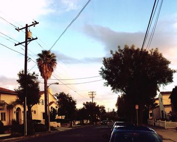 Road amidst trees against sky