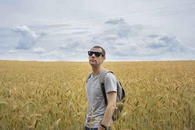 Young man standing on field