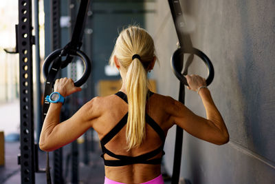 Low section of woman exercising in gym