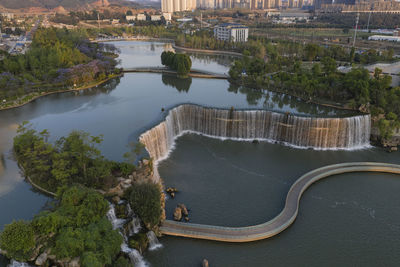 Aerial 360 degree view of the kunming waterfall park at sunset