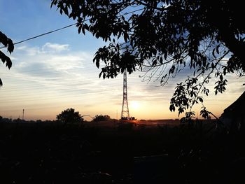 Silhouette trees against sky during sunset