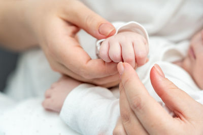 Cropped image of mother holding baby