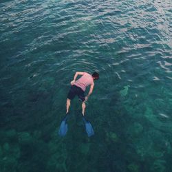 High angle view of man scuba diving in sea