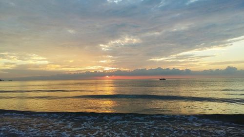 Scenic view of sea at sunset