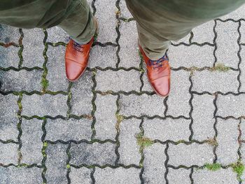 Low section of people standing on footpath