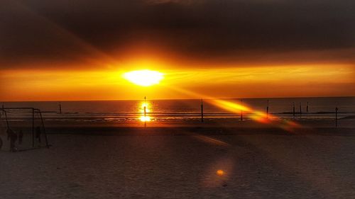 Scenic view of sea against orange sky