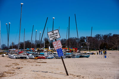 View of text on road against clear blue sky