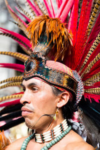 Portrait of man with multi colored umbrella