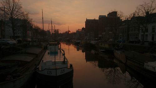 Boats moored at harbor