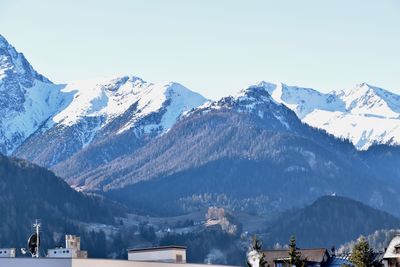 Scenic view of snowcapped mountains against sky