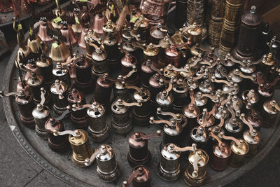 High angle view of coffee grinders for sale at market stall