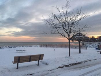 Scenic view of frozen sea against sky during sunset