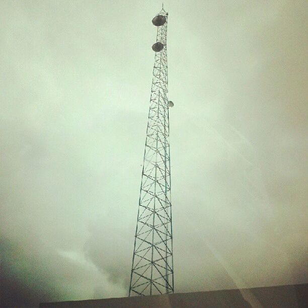 low angle view, sky, technology, electricity, tall - high, built structure, electricity pylon, fuel and power generation, connection, silhouette, metal, power supply, tower, power line, architecture, cloud - sky, dusk, communications tower, outdoors, no people