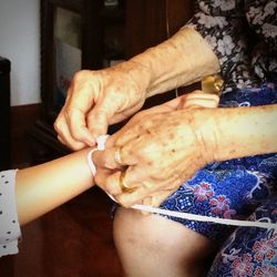 Cropped image of woman holding hands