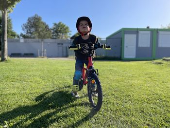 Portrait of young four year old boy on his bicycle 