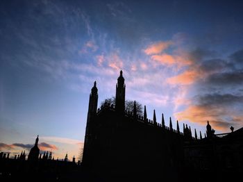 Silhouette of city at sunset