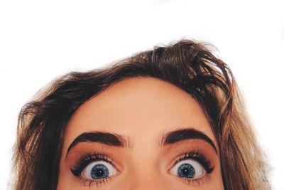 Close-up portrait of woman against white background