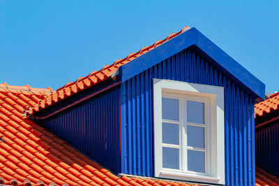 Low angle view of building against blue sky