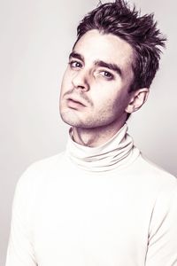 Portrait of young man against white background