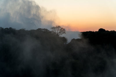 Scenic view of silhouette mountain against sky during sunset