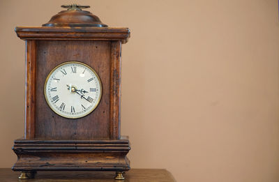 Close-up of clock on table