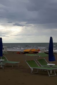 Empty chairs and tables in sea