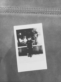 Reflection of woman on side-view mirror