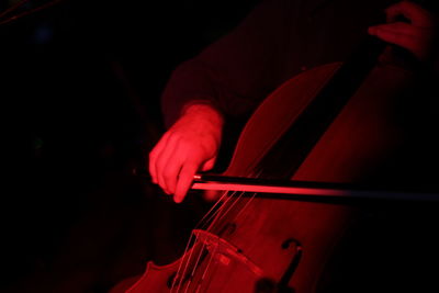 Cropped image of person playing cello