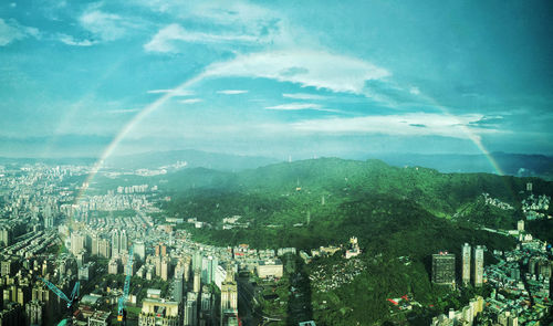 Aerial view of cityscape against sky