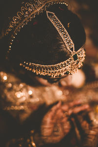 High angle view of bride wearing traditional clothing sitting in wedding ceremony