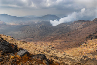 Scenic view of landscape and mountains against sky