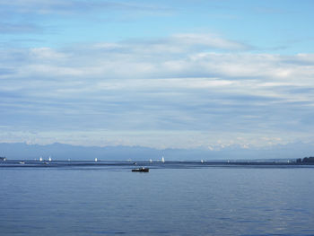 Scenic view of sea against cloudy sky