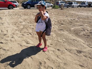 Full length of girl on sand at beach