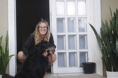 Woman with dog on window