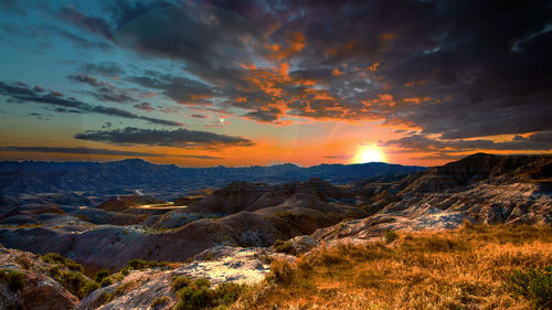 Scenic view of mountains against sky during sunset